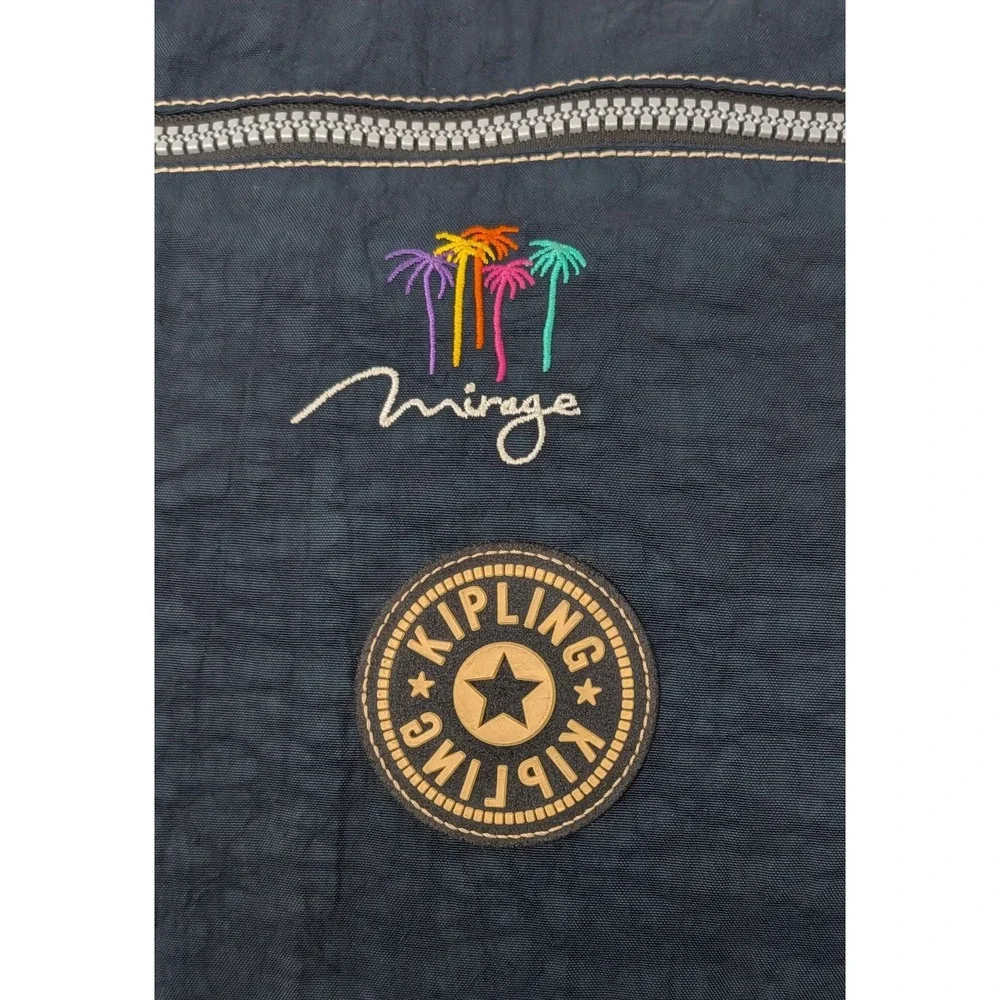 Kipling Madhouse Postman Bag Mirage Las Vegas Logo Expandable Messenger Bag Blue